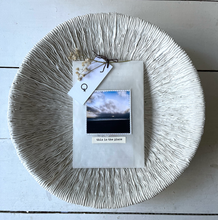 Load image into Gallery viewer, A hand wrapped personalised gift with a photo of a landscape on it